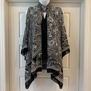 Chico’s Bare Shoulder shirt.  Has a black undershirt attached.  Size 1. (M8)